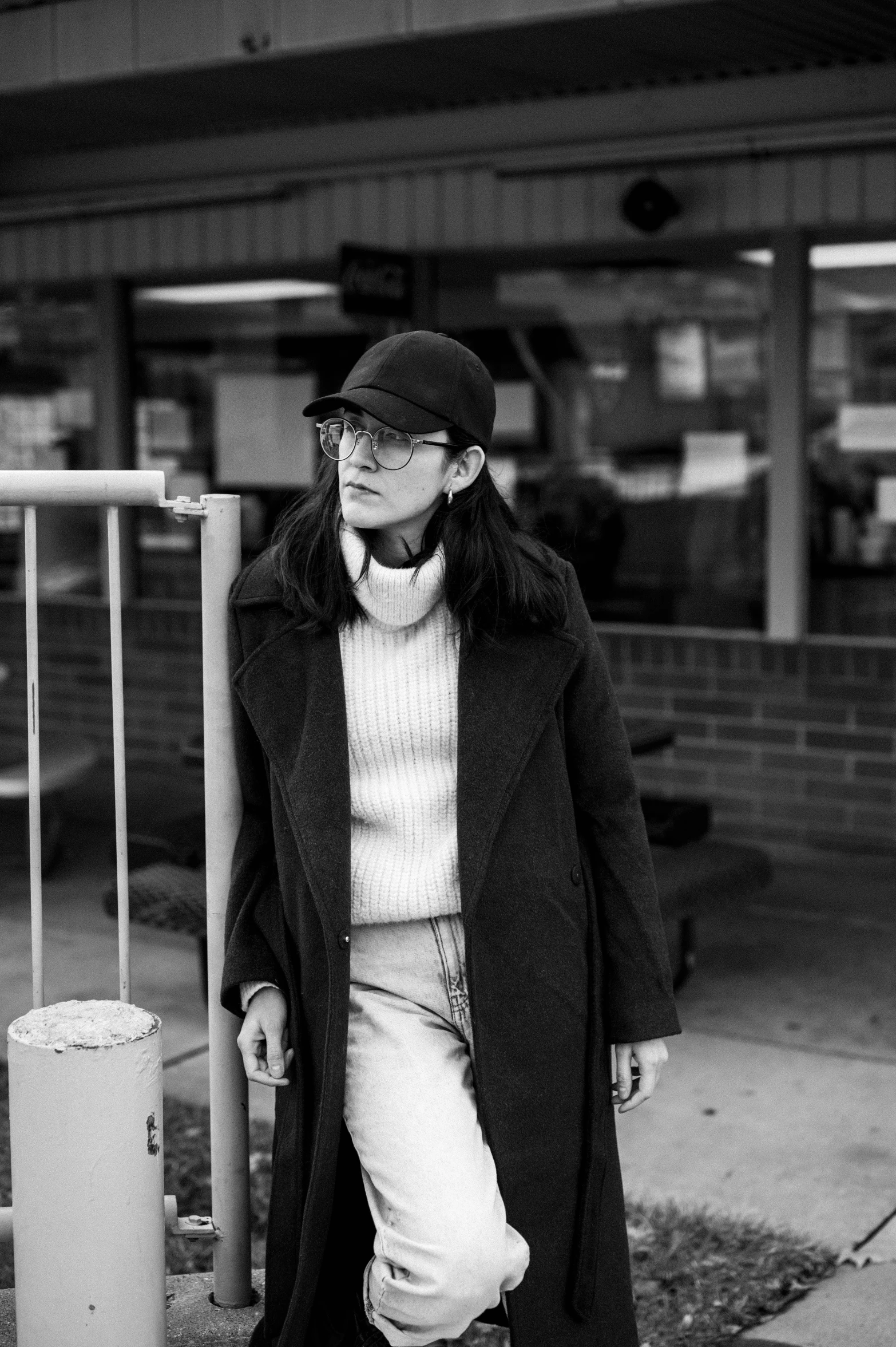 a man is walking down the street in a black and white po