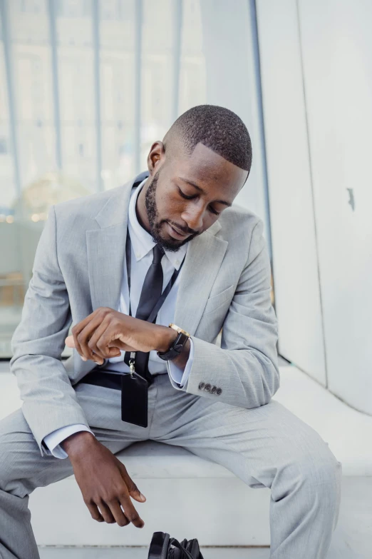 a man sitting on a bench with his shoes off