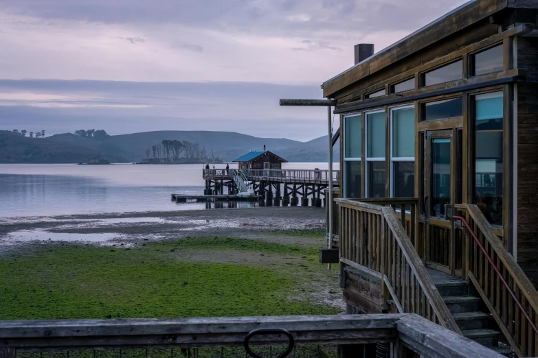 the view from a house shows the water and shore