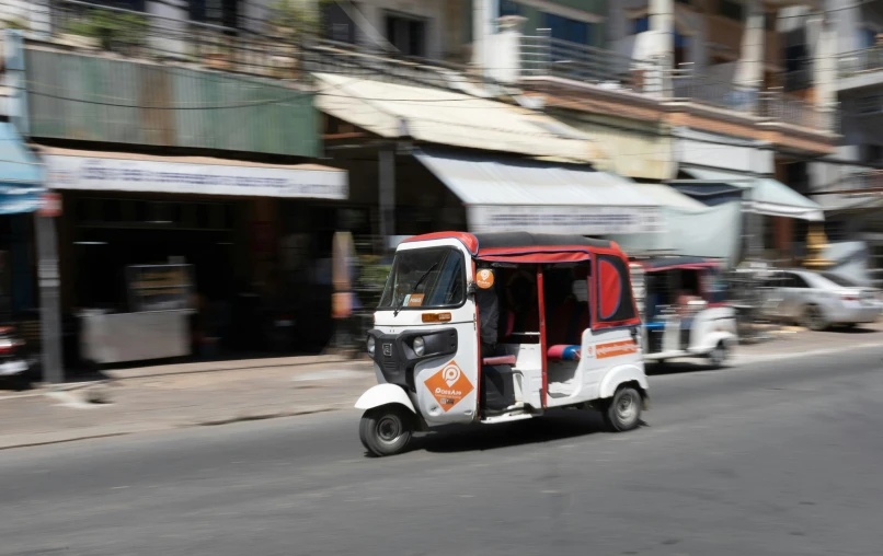 a street scene with cars driving down the road