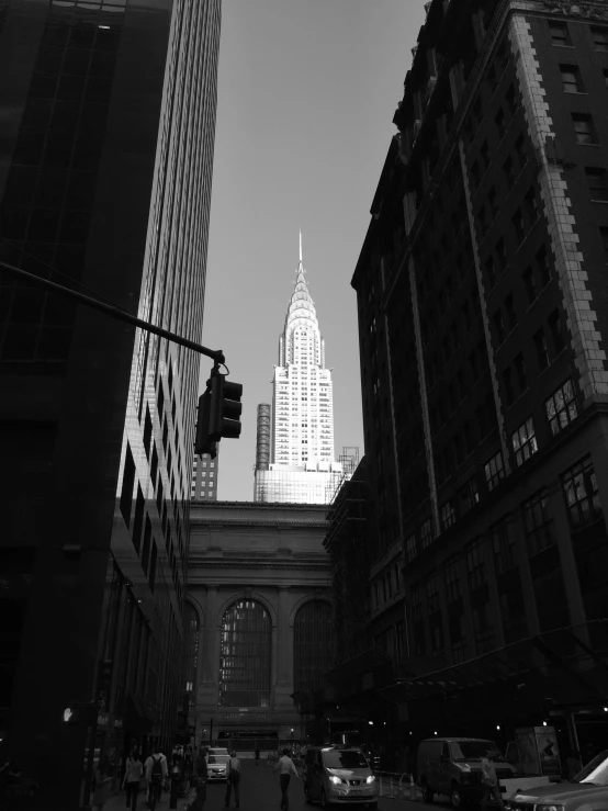 street with traffic lights and tall buildings in background