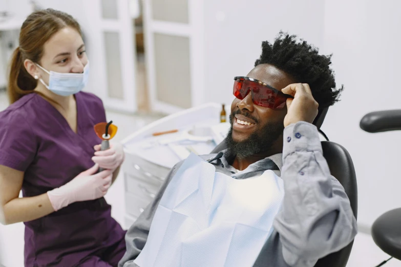 a man is wearing a face mask and sunglasses