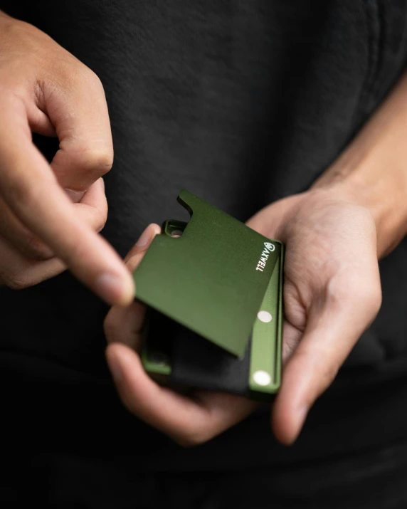 man holding some kind of electronic device in his hands