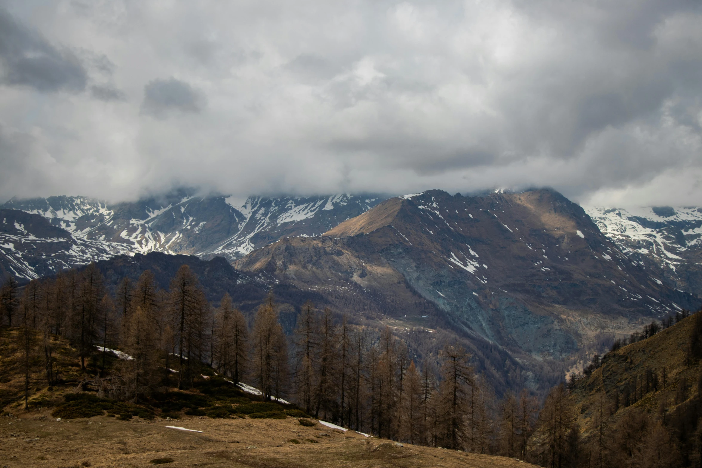 a snowy mountain on the top of the mountains