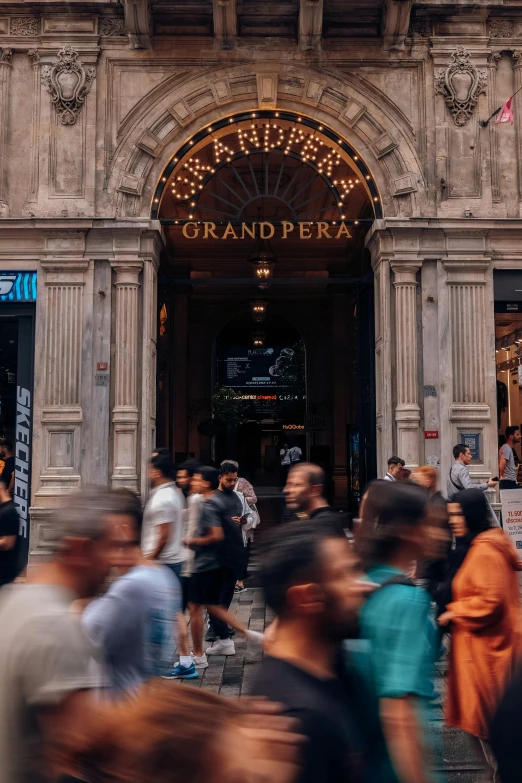 people are walking through the door of an old building