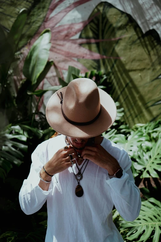 a man holding a cell phone near his face