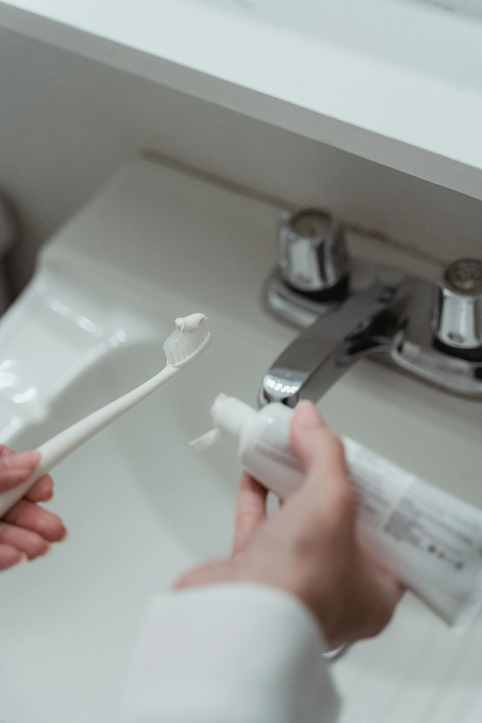 a person with his hand in the sink