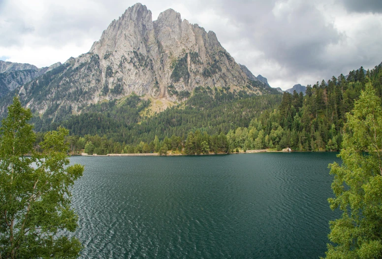 a large lake sitting near a large mountain range