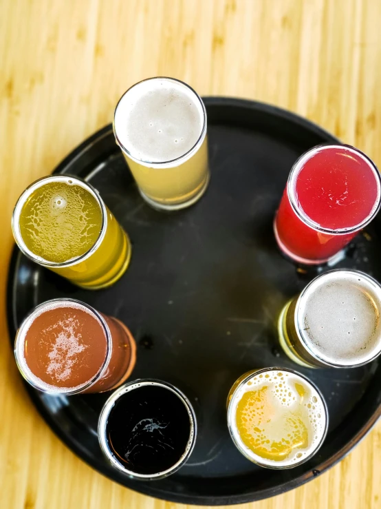 an overhead view of seven glasses of beer