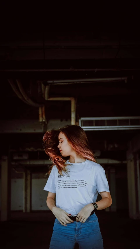 young woman with red hair in an empty building