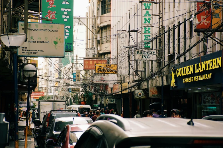 a street filled with lots of signs and traffic