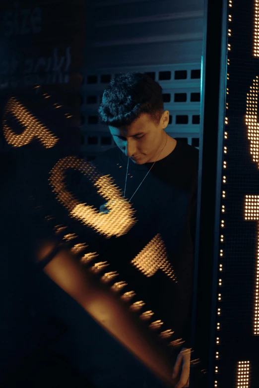 a man playing piano while looking through the lens