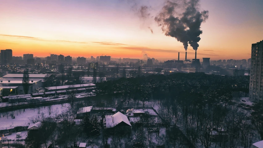 some smoke is coming from a factory chimney