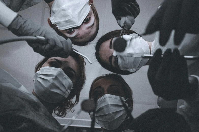 an image of people with bandaged around their faces