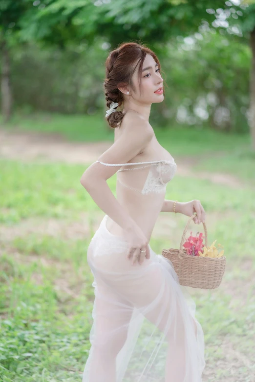 asian lady with a nice dress and basket of flowers