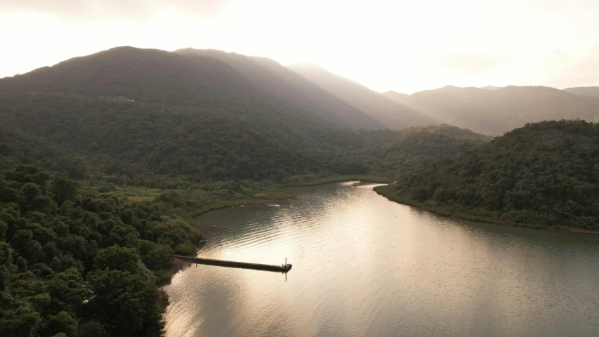 a lake surrounded by mountains on the shore