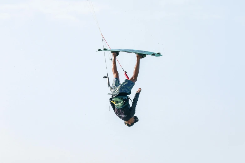 a man that is in the air with a board