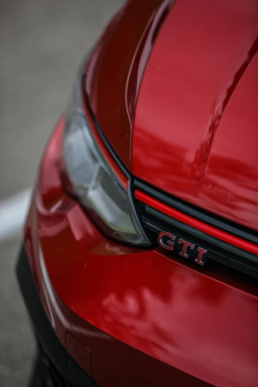 close up of the hood of a red car