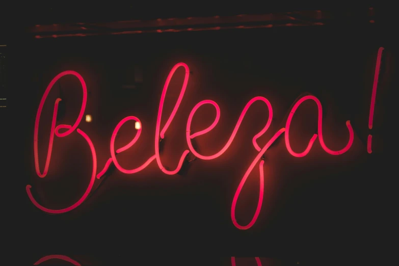 the neon sign for beleboa is illuminated with red light