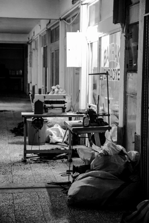 many bags are placed outside the building on the floor