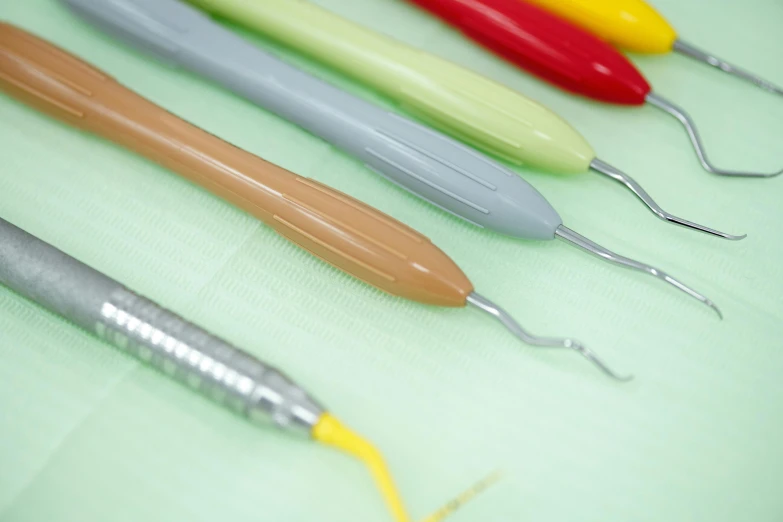 different dental utensils that are lined up