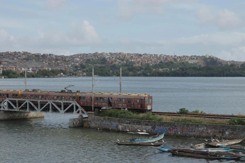 a body of water surrounded by a pier with several small boats