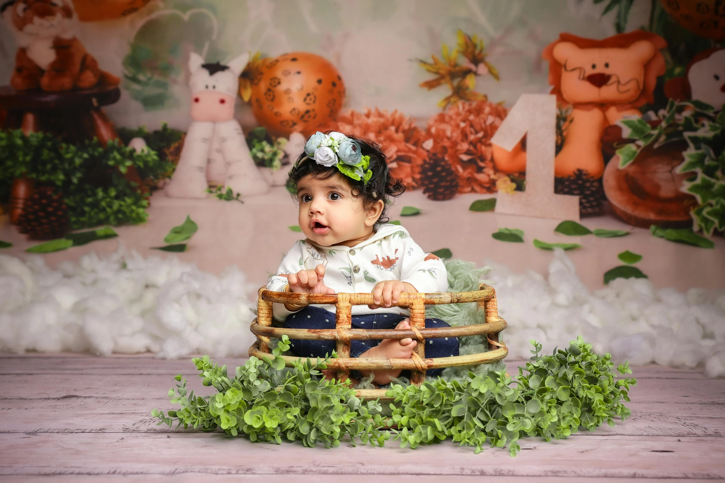 there is a baby that is sitting in a basket