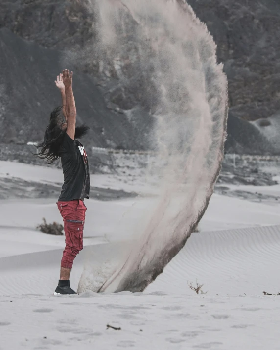 a man flying through the air while wearing shorts