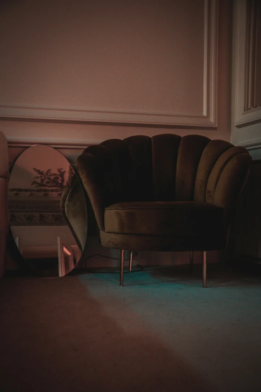 a very nice chair in a room near a mirror