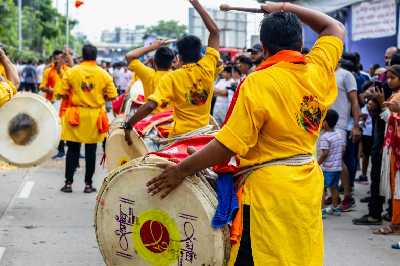 people playing music on drums in a parade