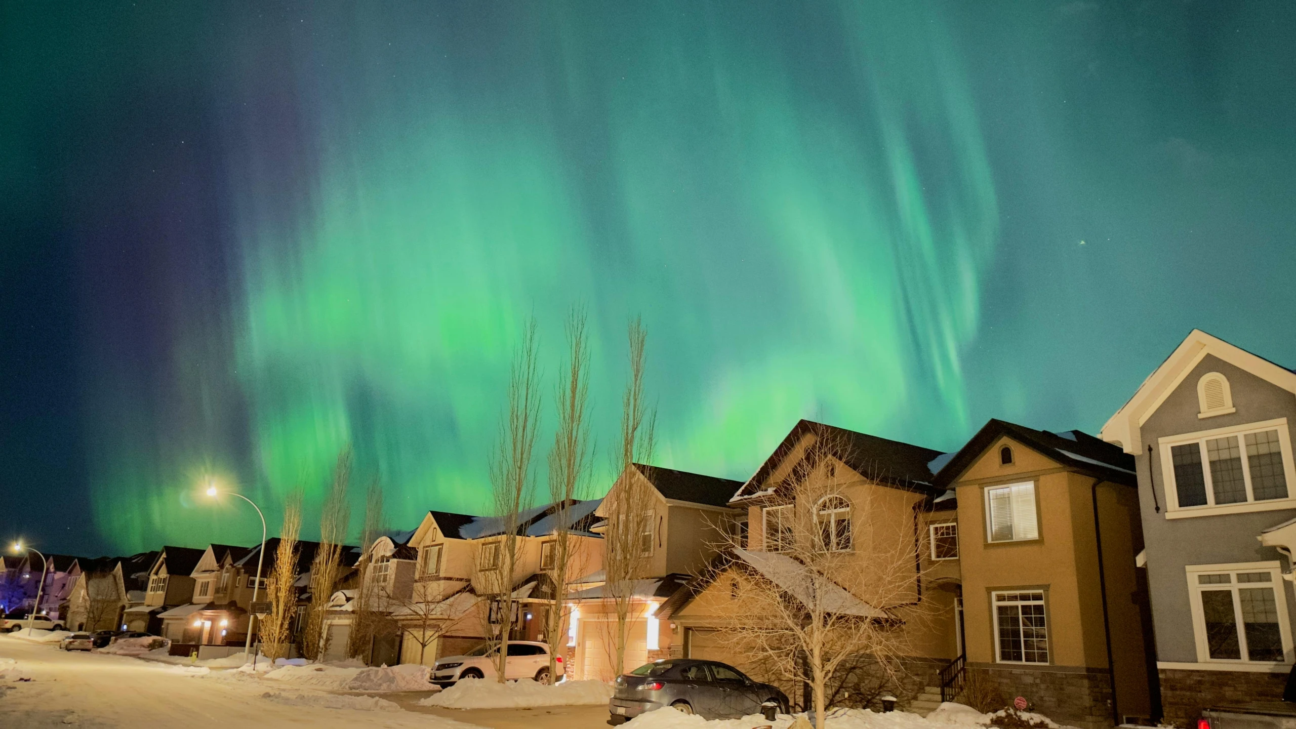 a house with an incredible northern sky in the background