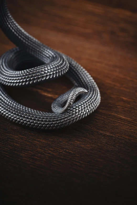 a rope that is sitting on top of a wooden table