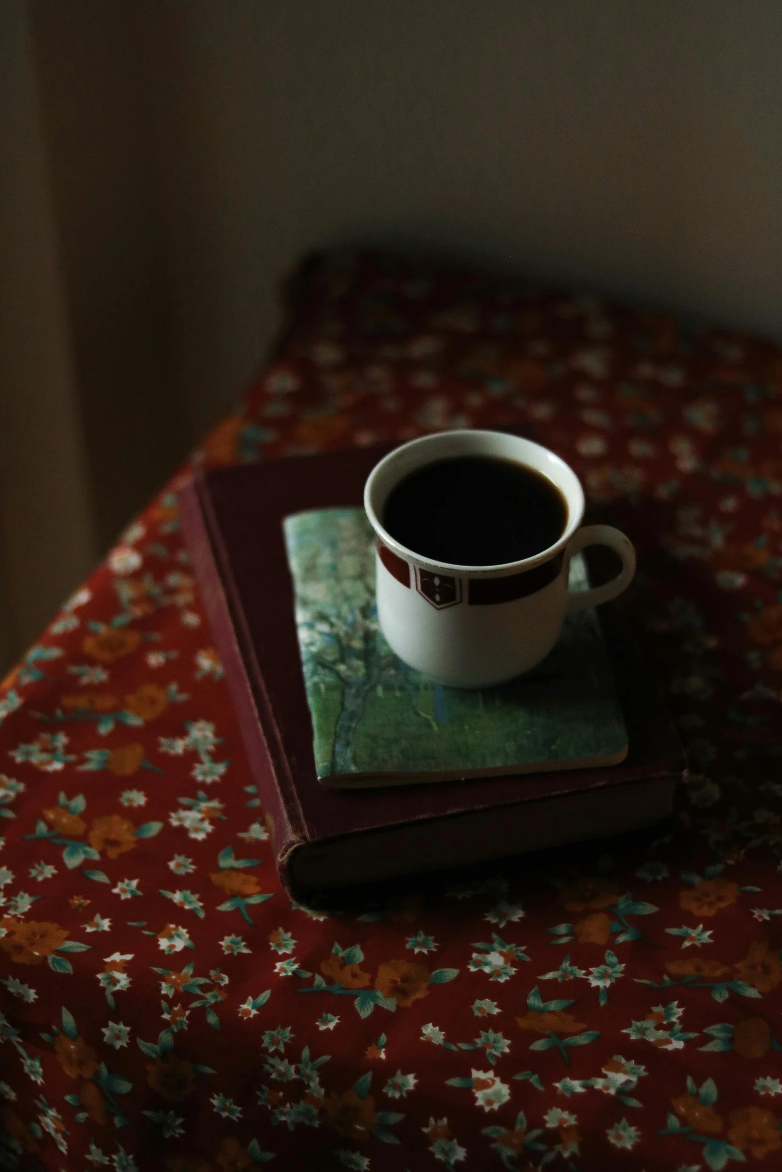a coffee cup on top of a book