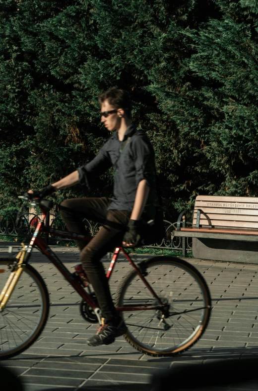 a young man on his bike during the day