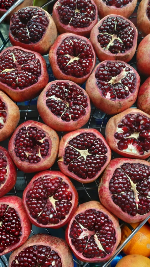 a variety of fresh pomegranates that are for sale