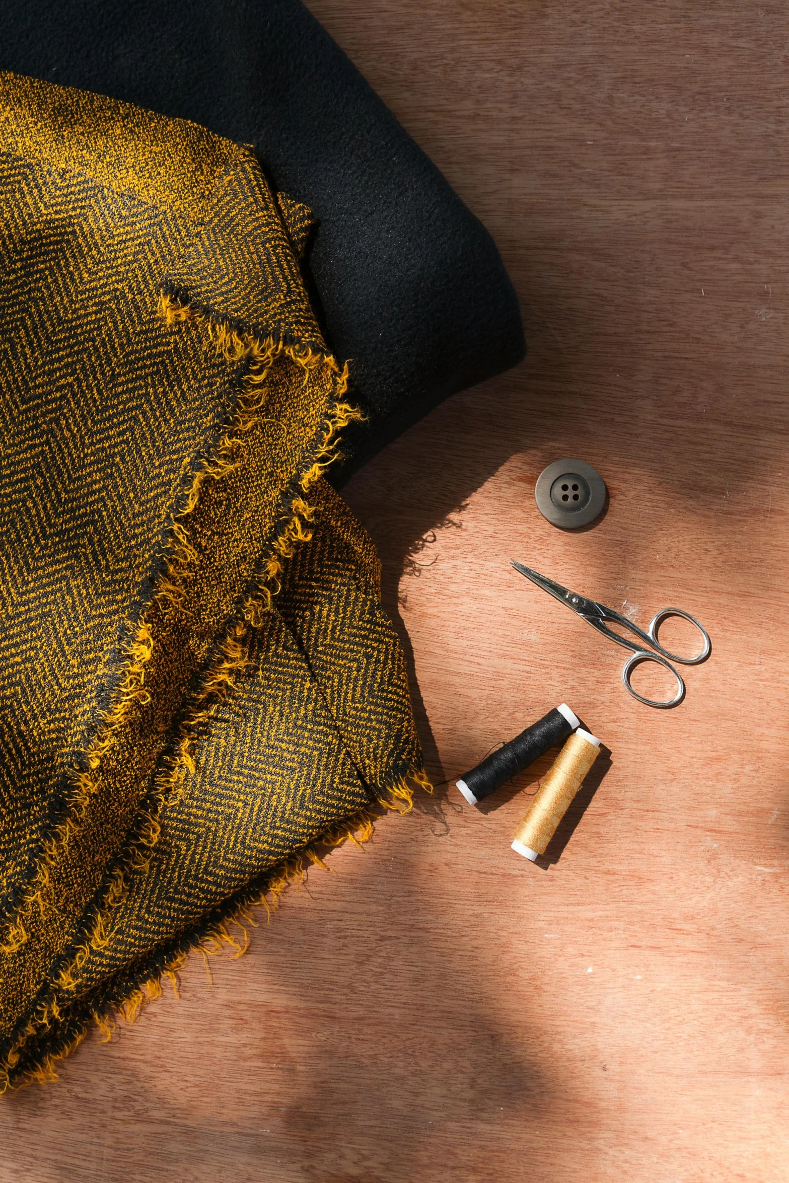 various craft tools are laying out together on a wooden surface