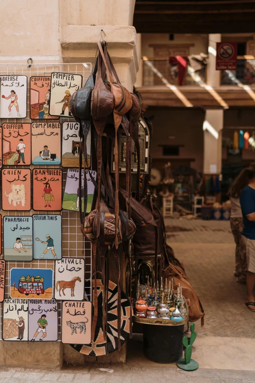 a cowboy hat hangs on the wall beside a display