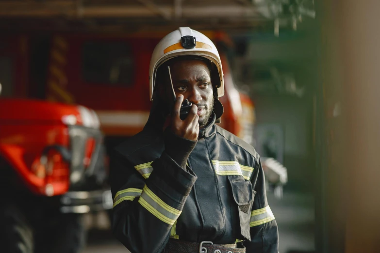 a firefighter has his face covered in dust