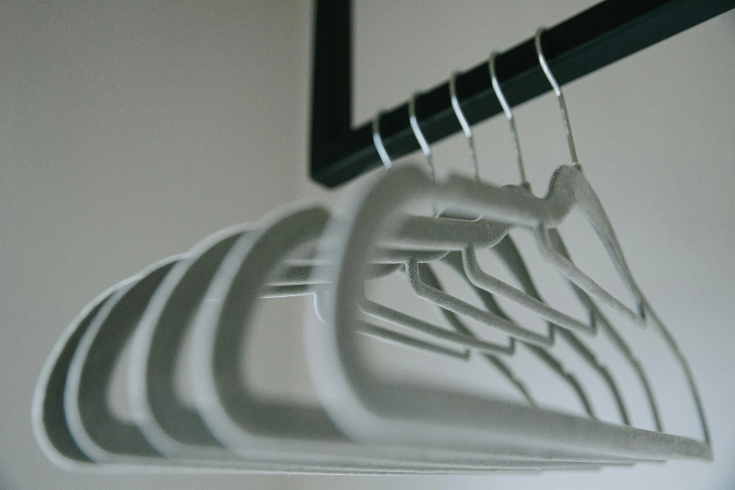 a white dish sitting on top of a clothes rack