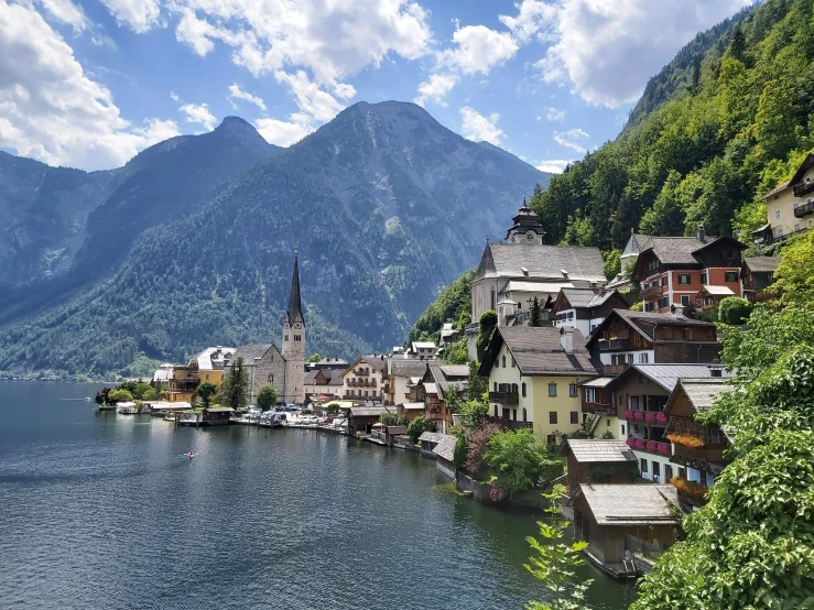 the lakeside city has mountains in the distance