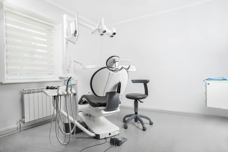 the room features a chair and other medical equipment