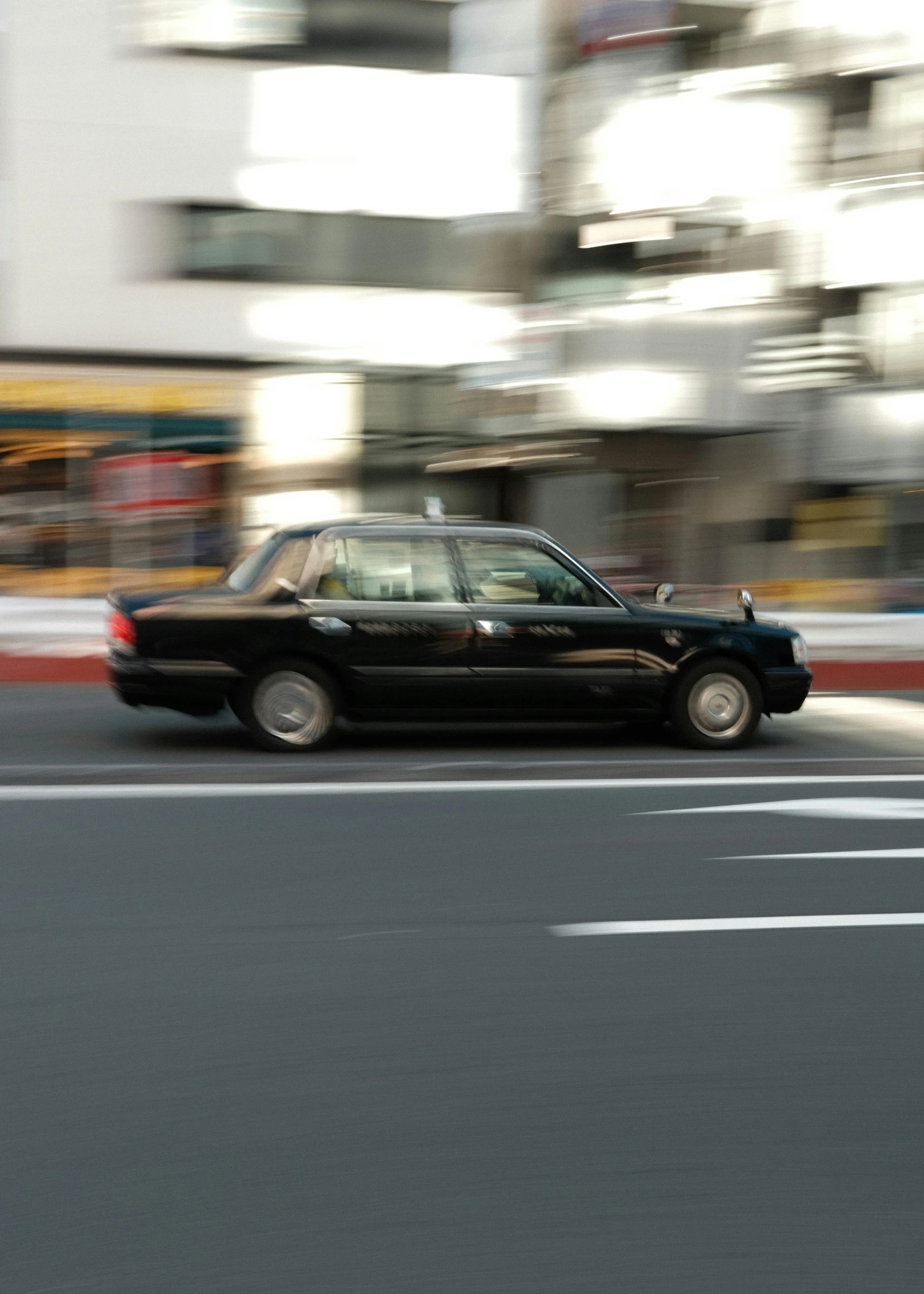 an image of a car driving down the street