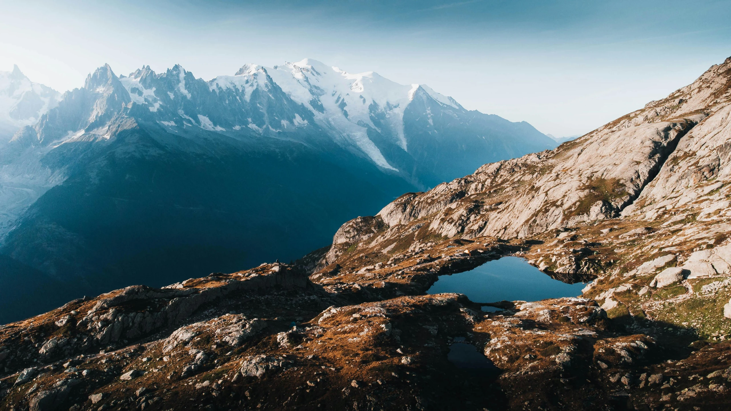 mountains with snow on them and water in it