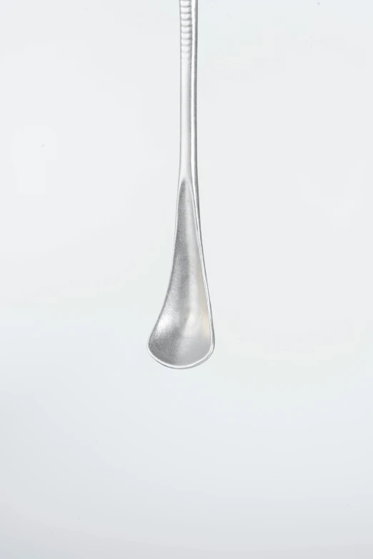 a spoon and fork hanging from a pole