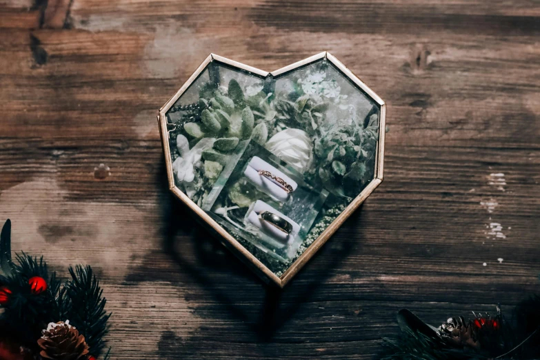 an old pograph is set inside a heart shaped box