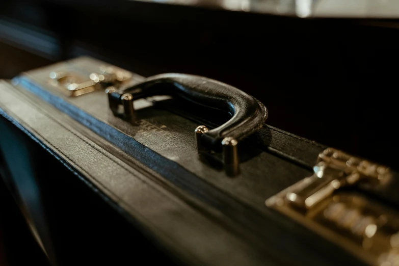 an old luggage case with two keys is opened