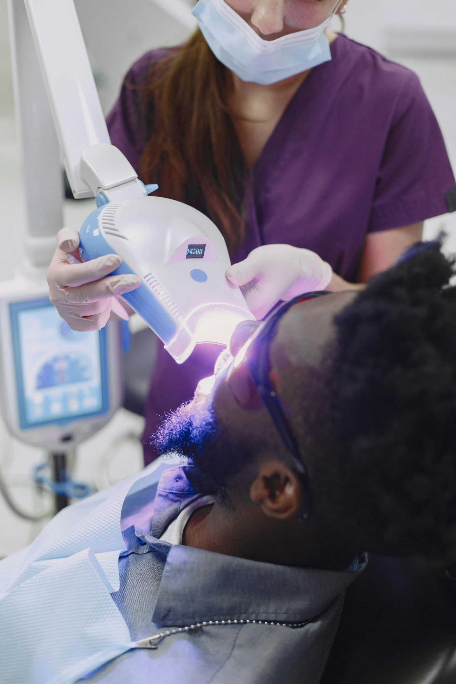 a man being assisted in the dental procedure