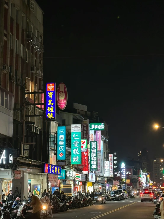 a large city street that has many signs on it