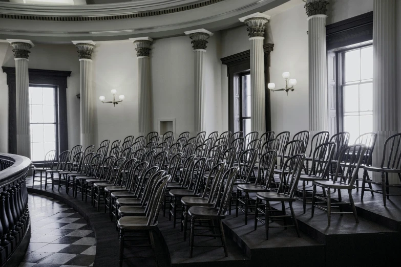 a room full of empty chairs and benches