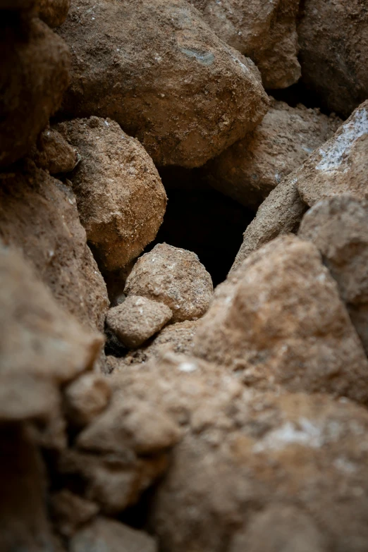 an odd, close up view of rocks that have been dug into